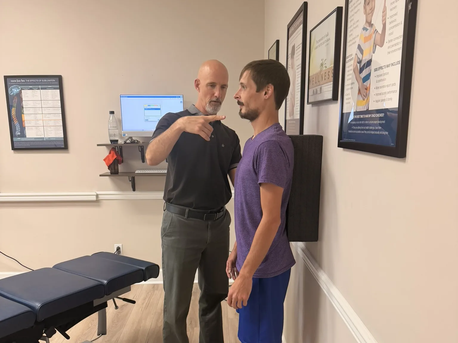 Dr. Jon Scott, chiropractor near Cedar Bluff, TN, checking a patient’s standing posture