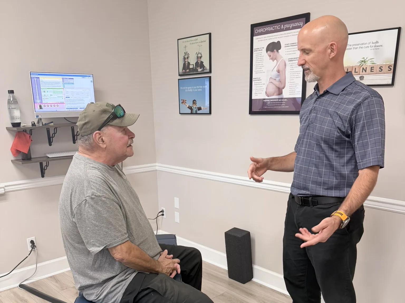 Dr. Jon Scott, chiropractor near Oak Ridge, TN, talking with a patient before an adjustment