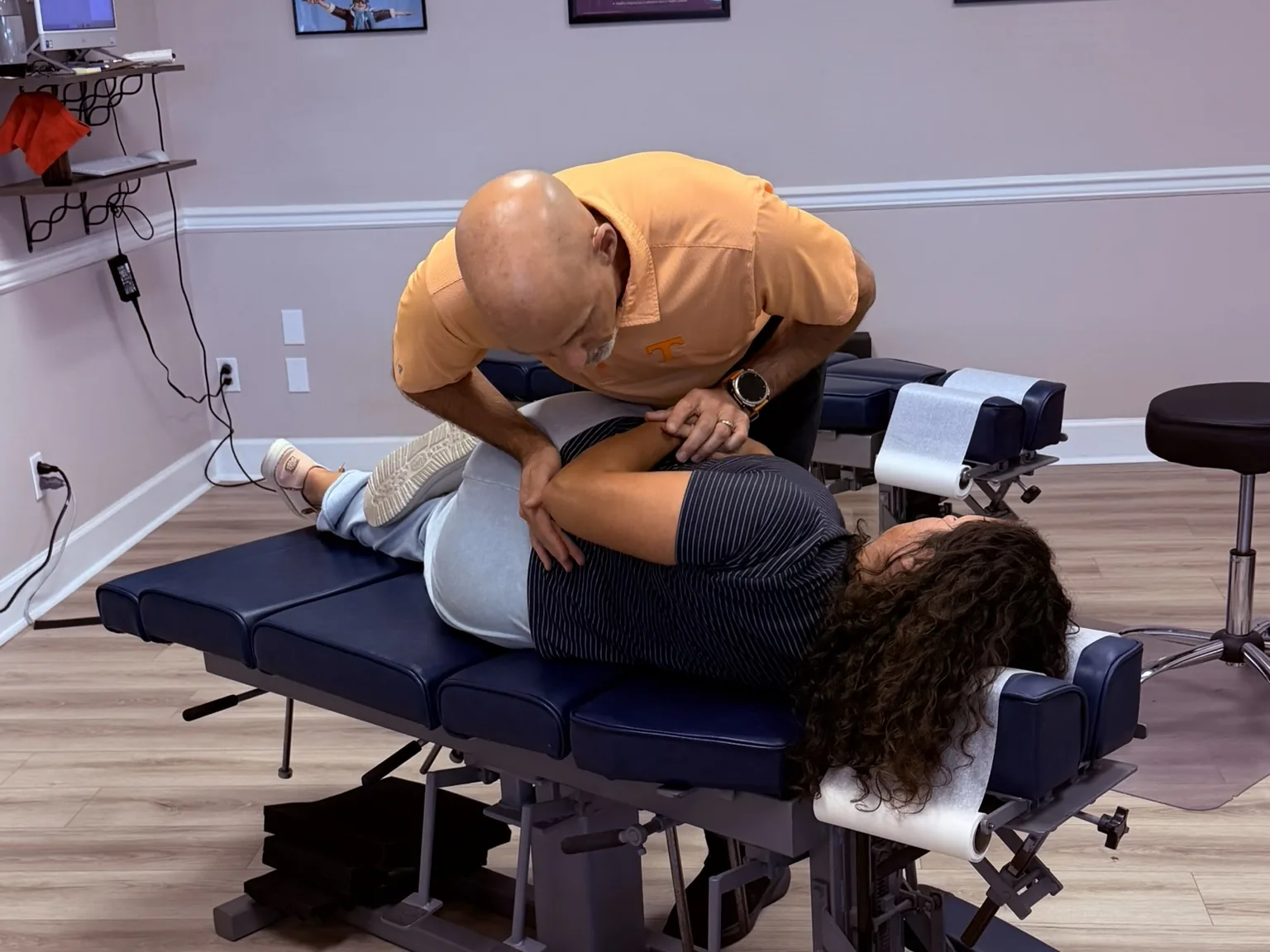 Dr. Jon Scott giving a hands-on side-posture adjustment